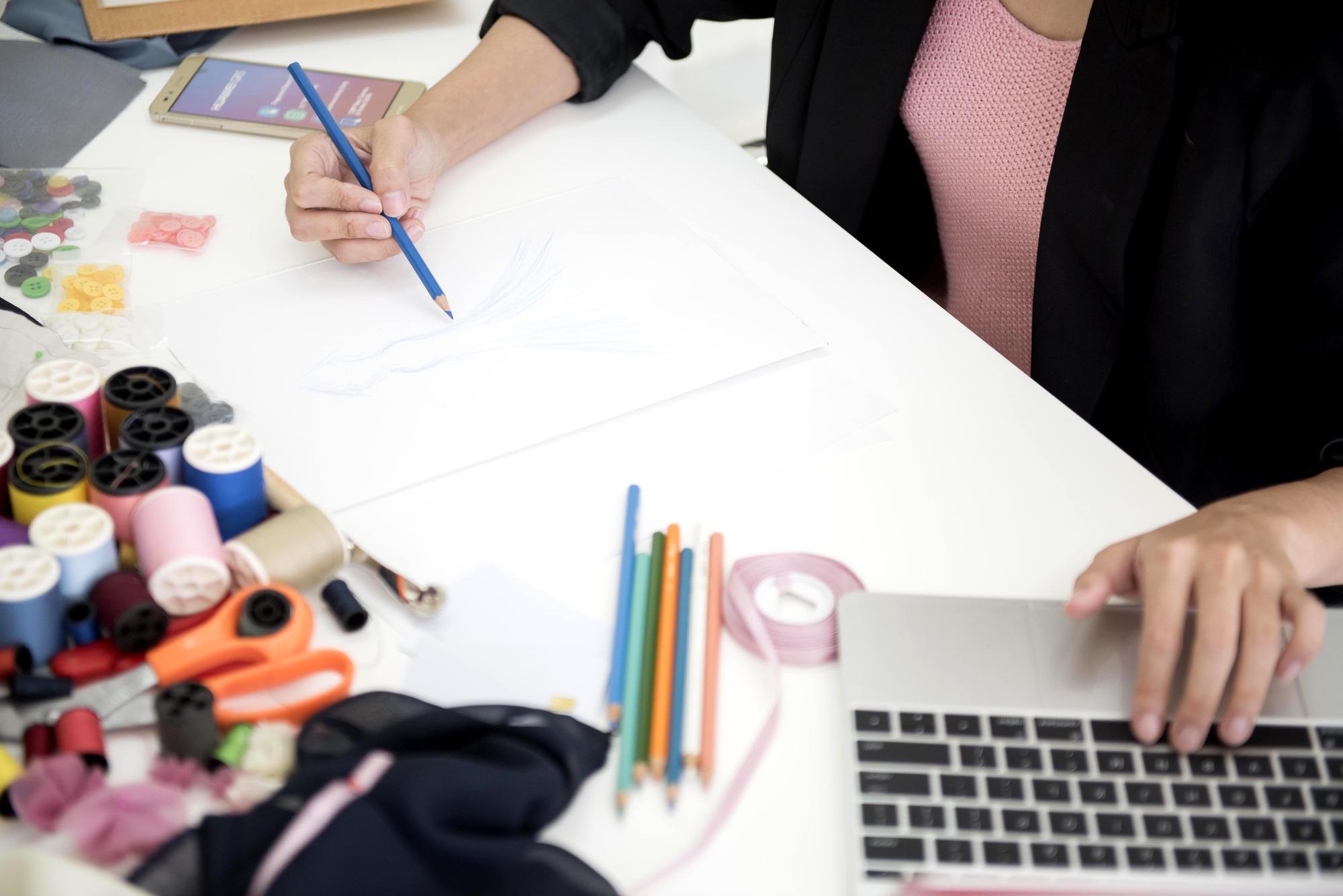 Workspace with embroidery hoops and threads